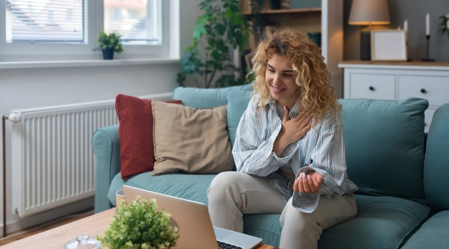 Person on a video call for a telehealth therapy session