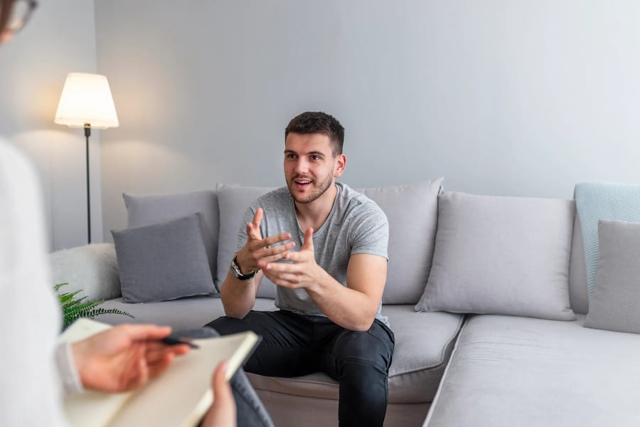 A client in a calm, modern therapy session