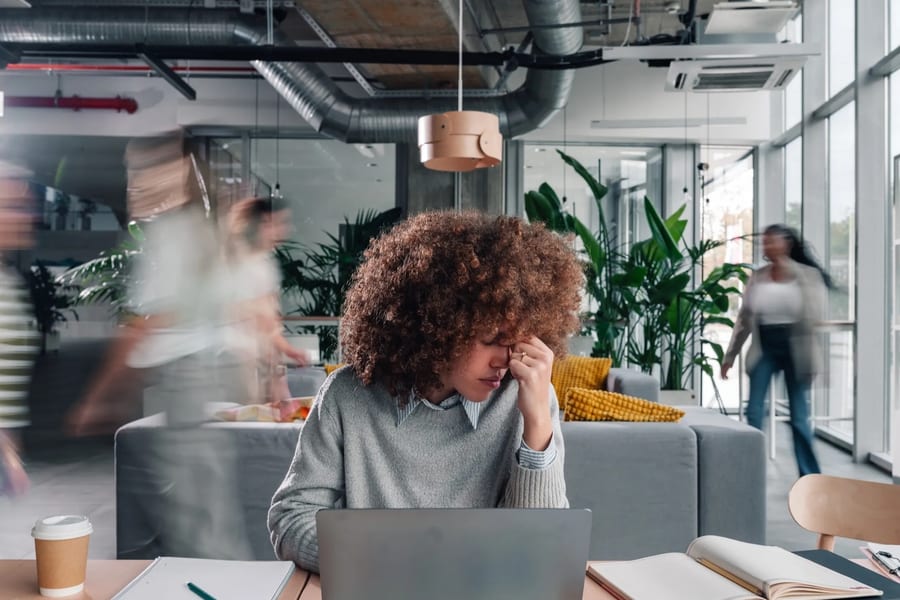 A professional taking a quiet pause in a modern office